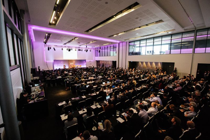 People looking at a screen at Emirates Old Trafford