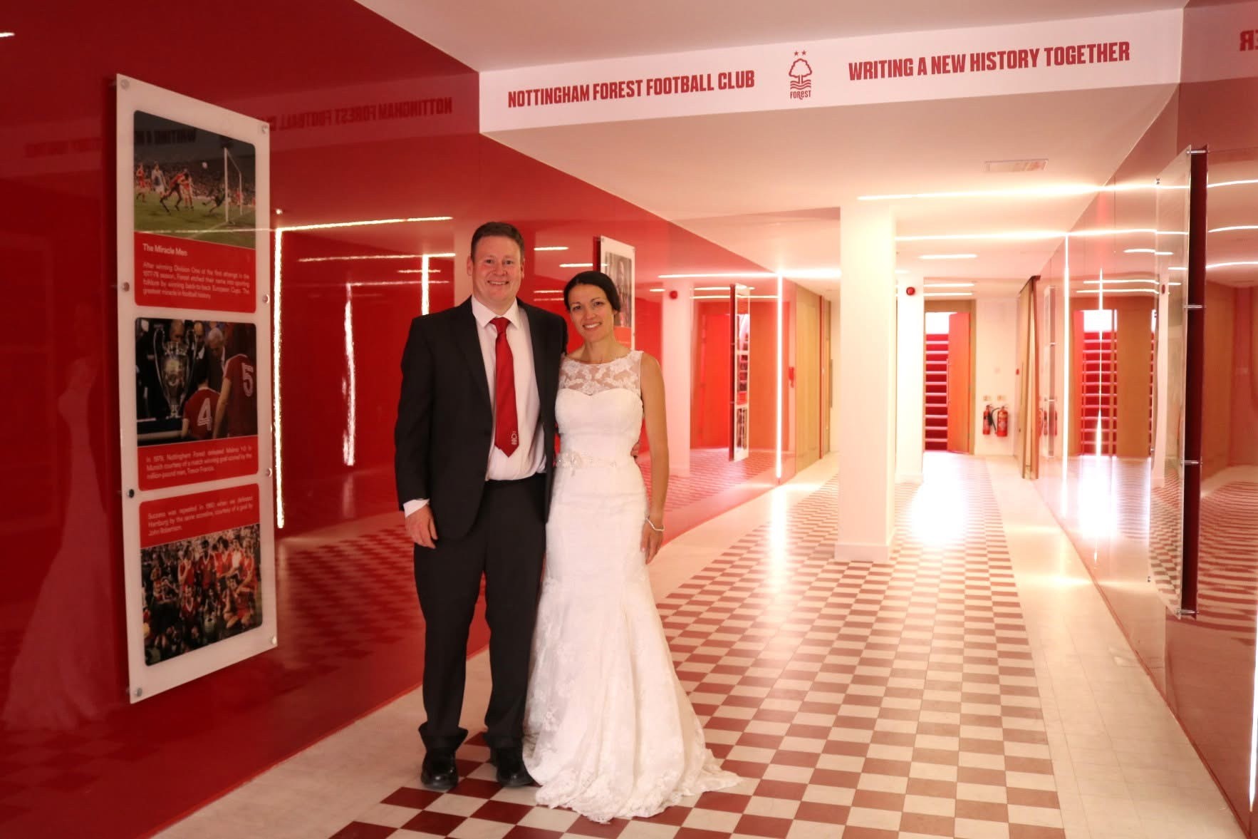 Couple on their wedding day inside a stadium