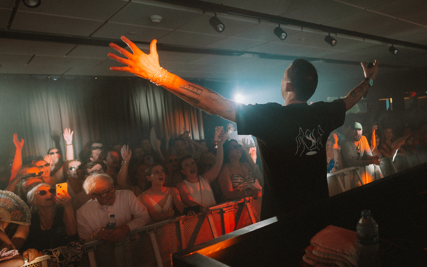 DJ on stage in front of crowd