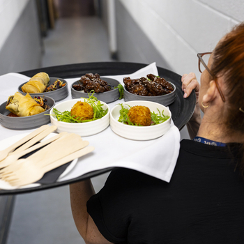 Platter of food being carried