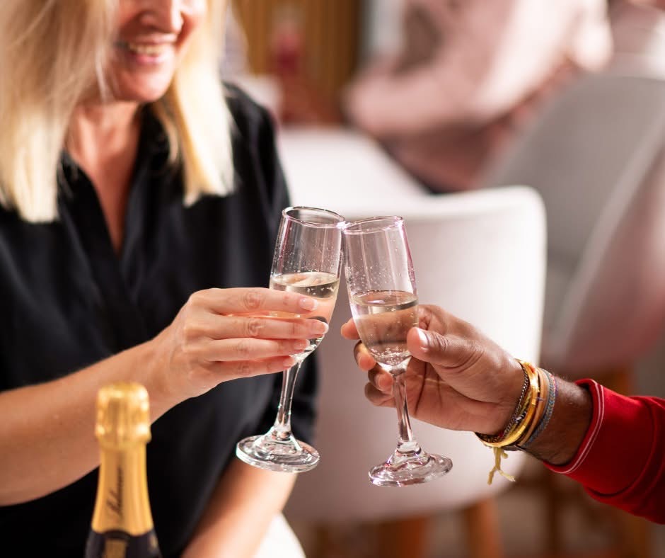 Women clinking champagne glasses