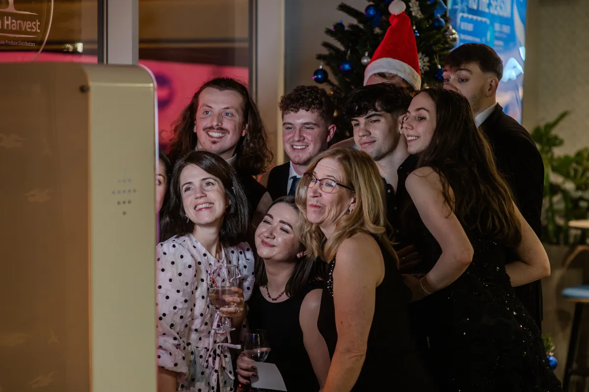 People posing at a photobooth at BHAFC