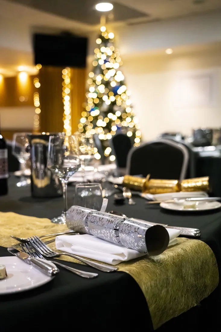 Table with Christmas cracker and Christmas tree at Ewood Park