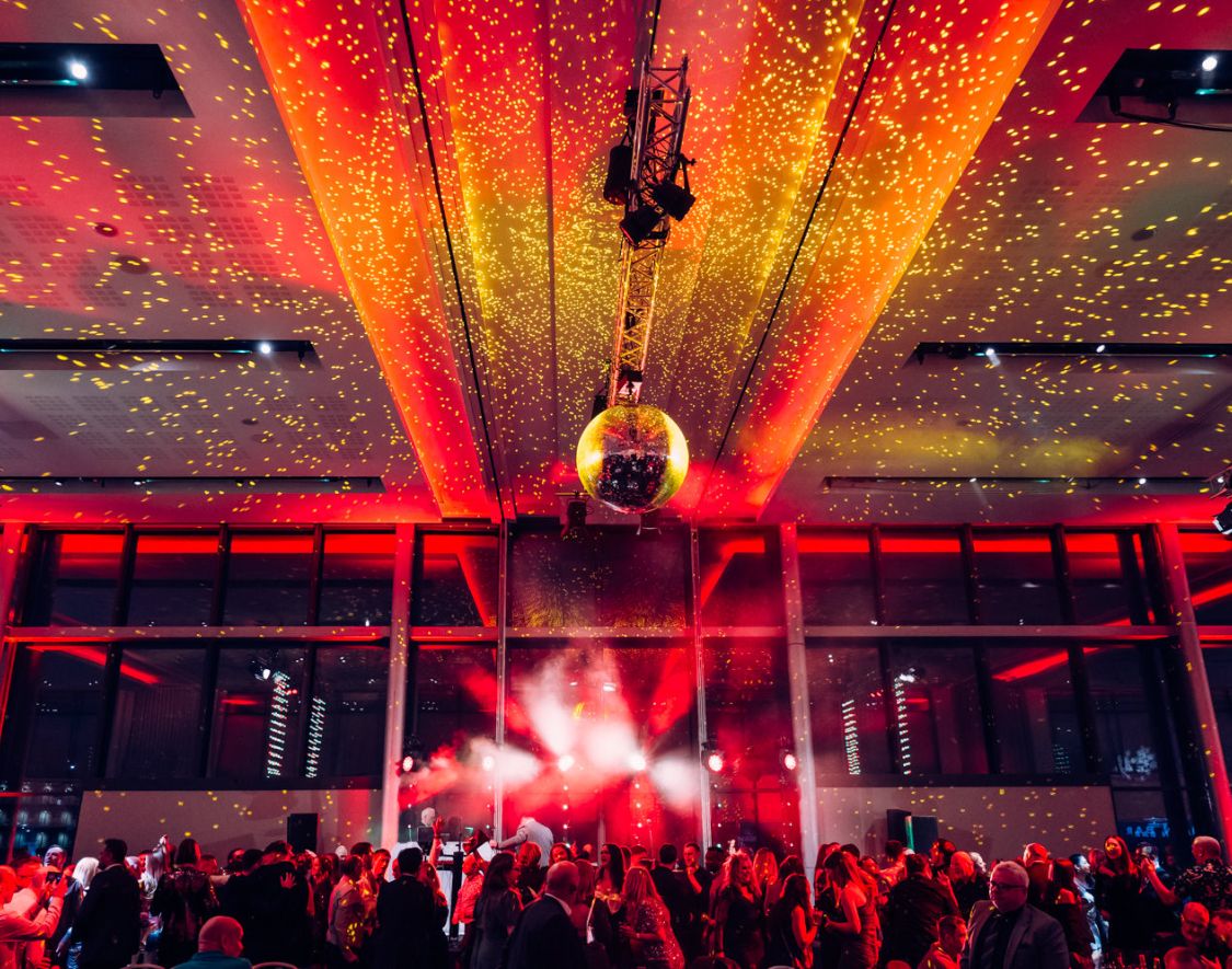 a shining disco ball shining across an event